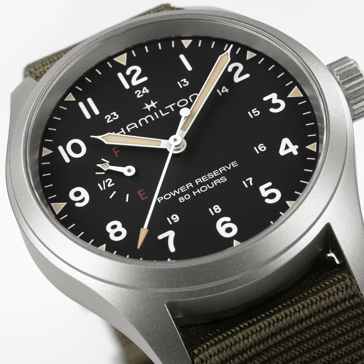 Hamilton Khaki Field H69509930 40mm watch close-up detail displaying black dial, Arabic numerals, power reserve gauge, and brushed bezel