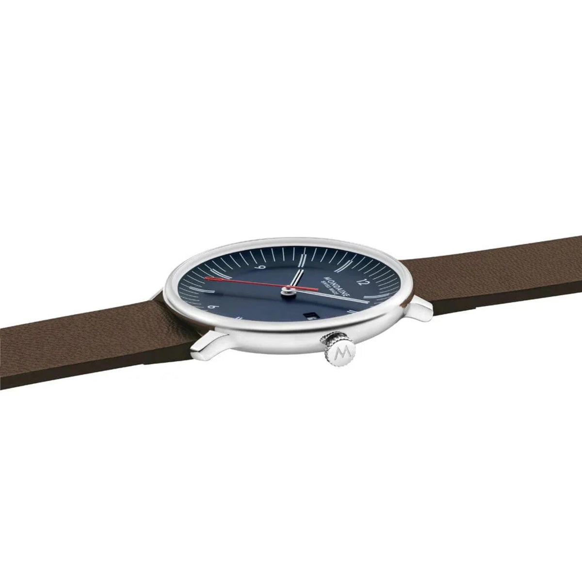Side profile of Mondaine Doppio blue dial watch showing its slim, polished silver stainless steel case, the textured crown engraved with the 'M' logo, and the domed sapphire crystal