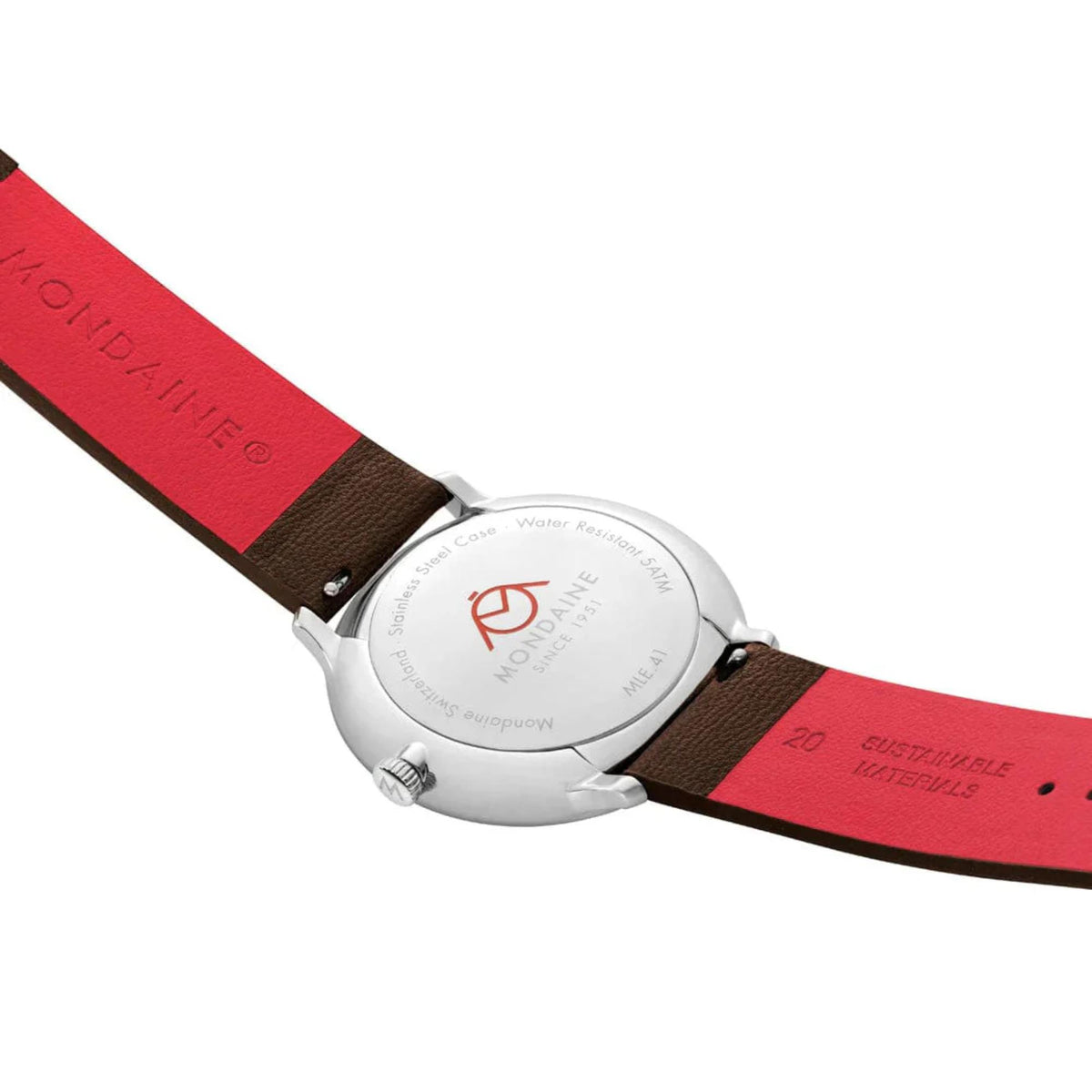 Close-up of the Mondaine Doppio watch's silver-tone stainless steel caseback, highlighting the engraved Mondaine logo, water resistance specifications, and the red underside of the leather strap