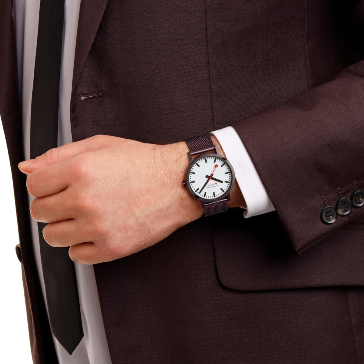 Mondaine Classic A660.30360.1BSBZ quartz timepiece worn on wrist under a dark suit sleeve