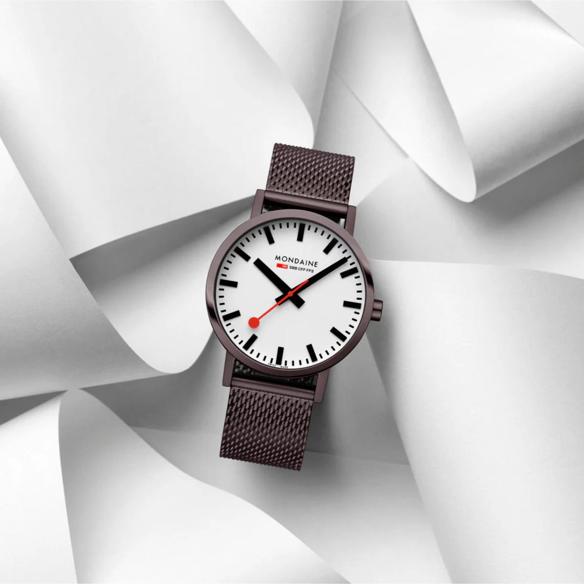 Mondaine Classic A660.30360.1BSBZ dress watch posed on white sculpted paper background