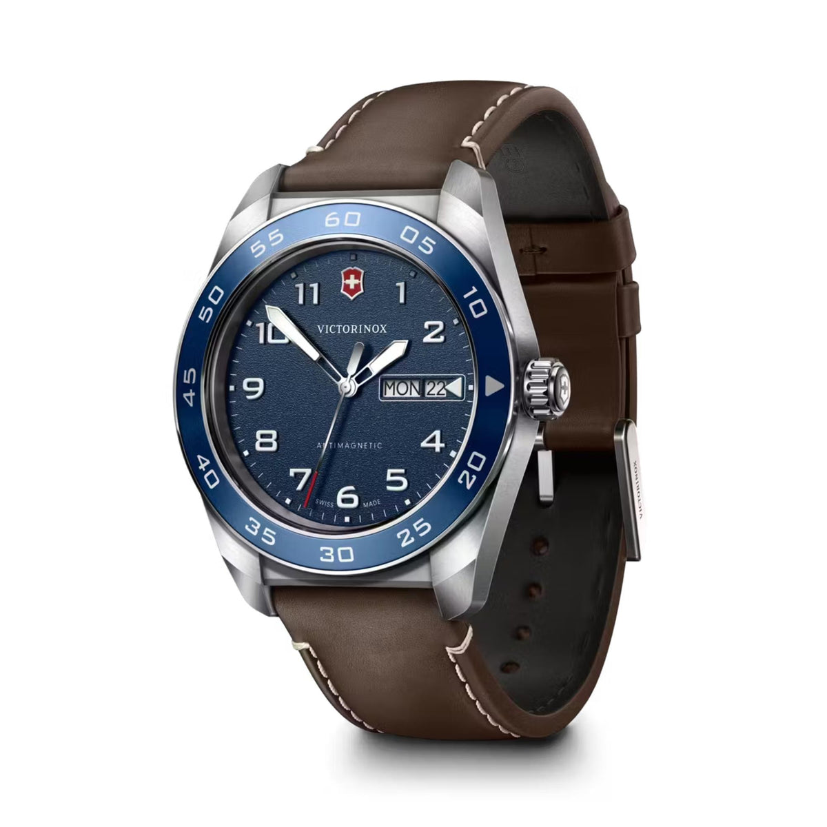 Men's quartz watch with blue bezel and brown leather strap, silver case and crown