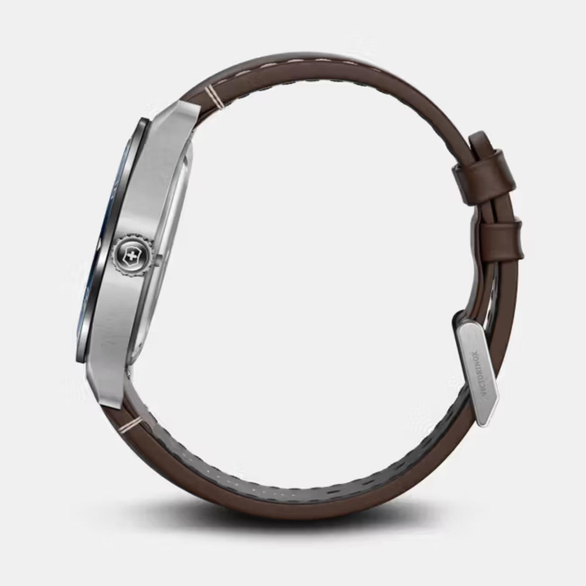 Brown leather watch strap with silver case edge and buckle, side view
