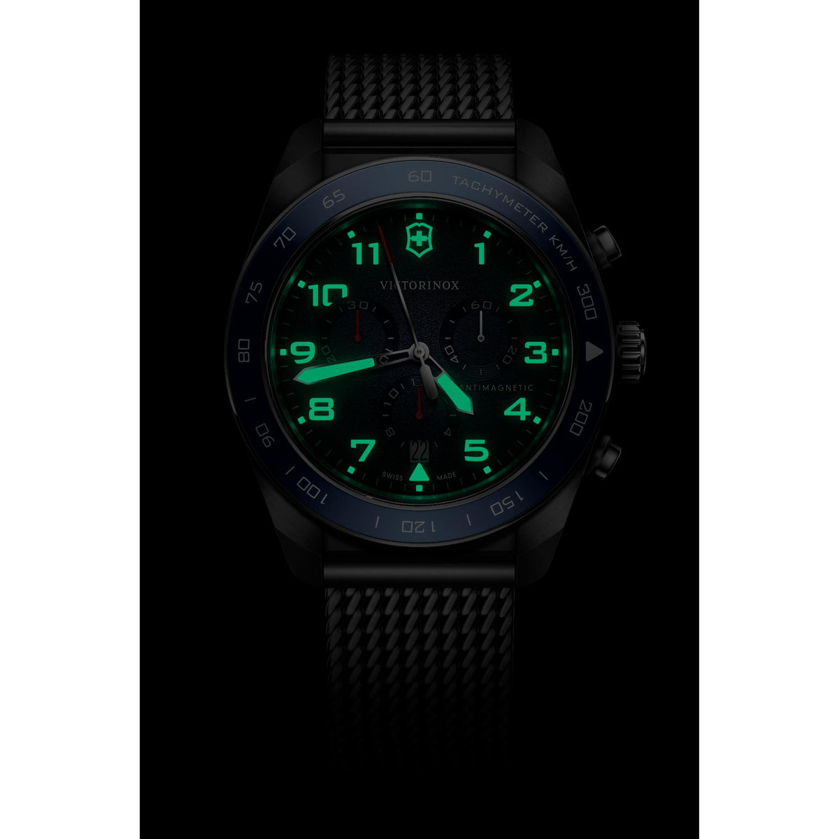 Victorinox Swiss Army 242049 Chronograph watch with intense green lume on black dial in dark environment