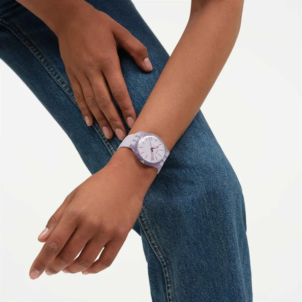 Lavendaze watch on wrist with lavender silicone strap and red index dial