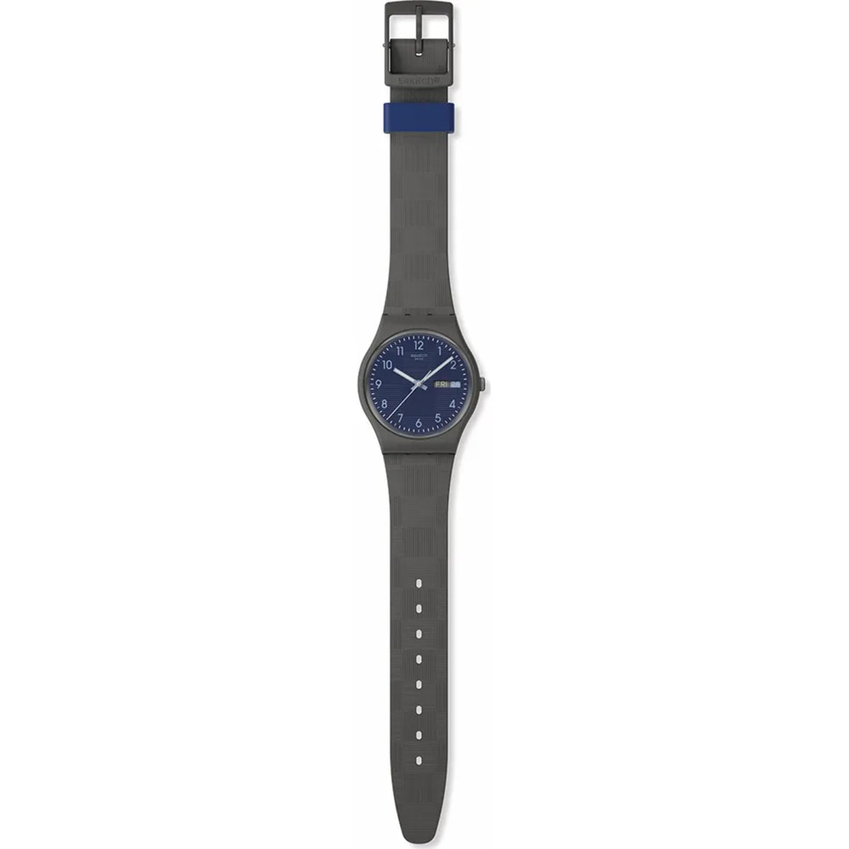 Quartz watch with dark blue dial and gray silicone strap; day/date at 3 o'clock