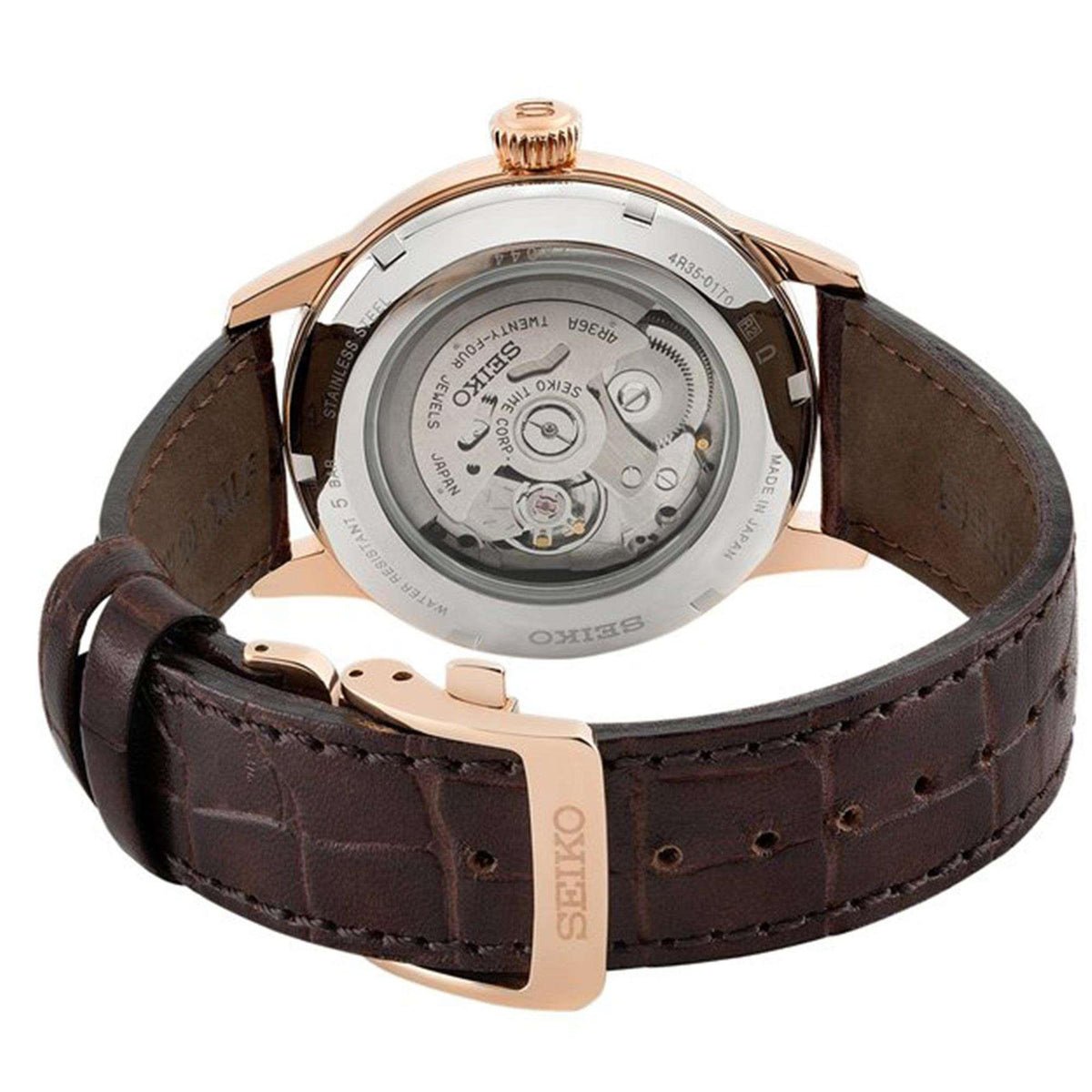 Automatic watch back on brown leather strap with rose-gold case and visible caseback