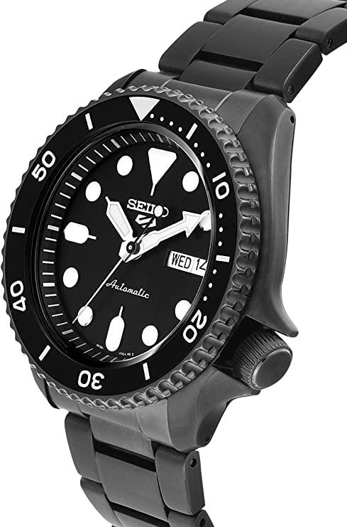 Side view of men's automatic watch with black dial, black bezel, and visible crown; WED 12