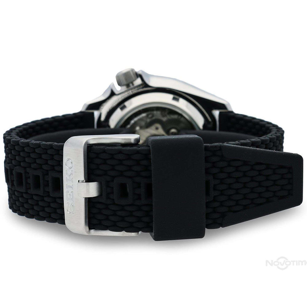 Men's Seiko wristwatch side view showing black silicone strap and rectangular buckle