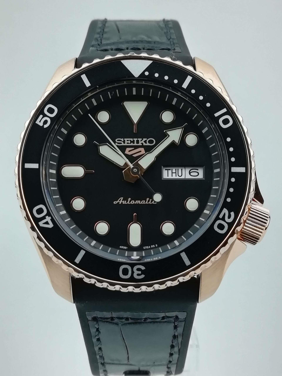 Men's Seiko 5 Sports automatic watch with black dial, day/date window, black strap