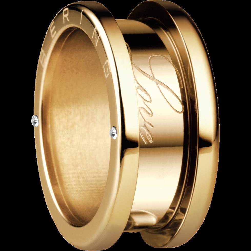 Gold-tone ring band with oval face showing engraved pattern and two side stones