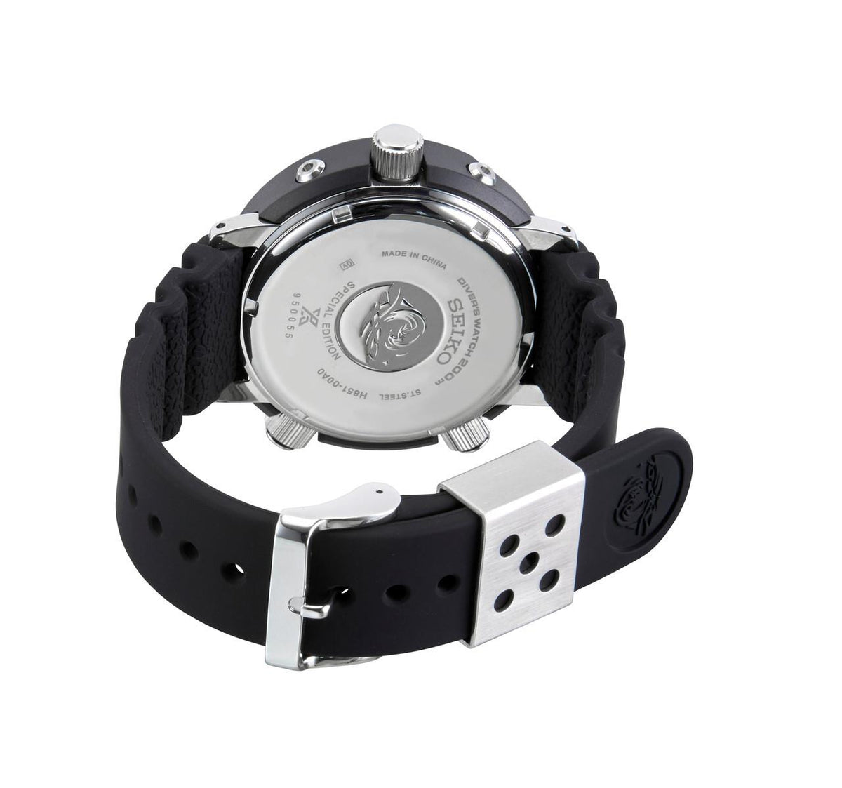 Men's Seiko dive watch caseback with silver plate, black silicone strap, and metal buckle.