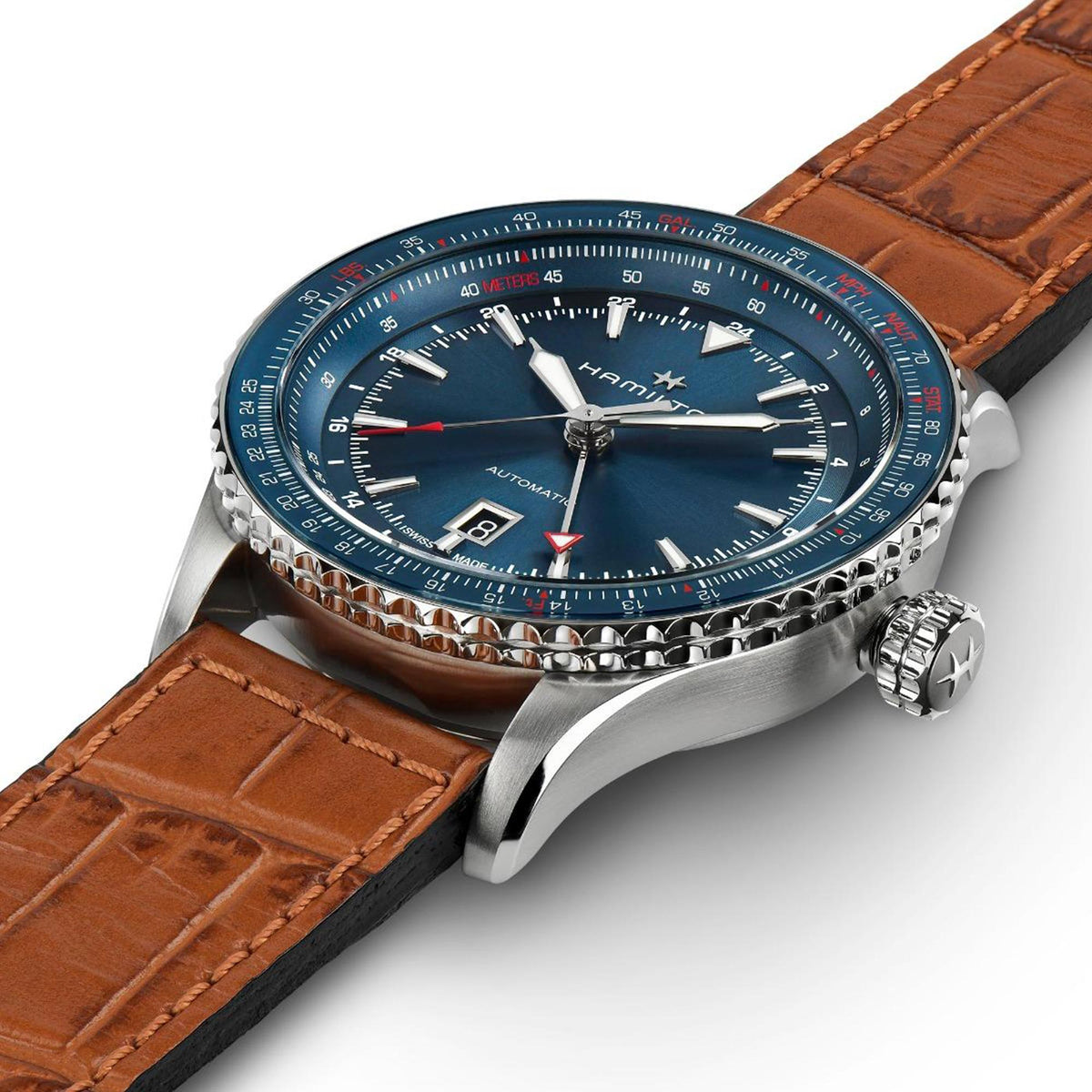 Blue dial GMT watch with brown leather strap, stainless case and crown at 3