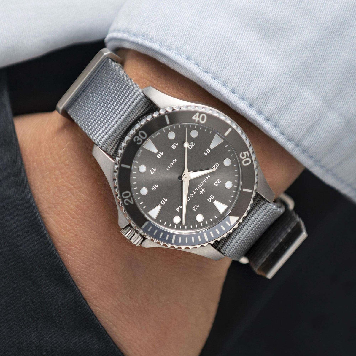 Men's quartz wristwatch on grey NATO strap with grey dial and round stainless-steel case
