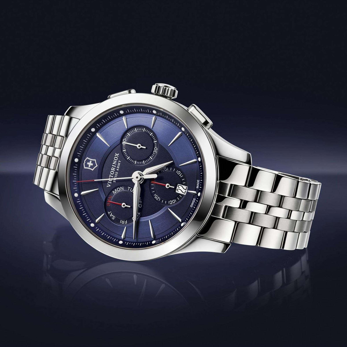Men's chronograph watch with blue dial, white hands, silver stainless bracelet
