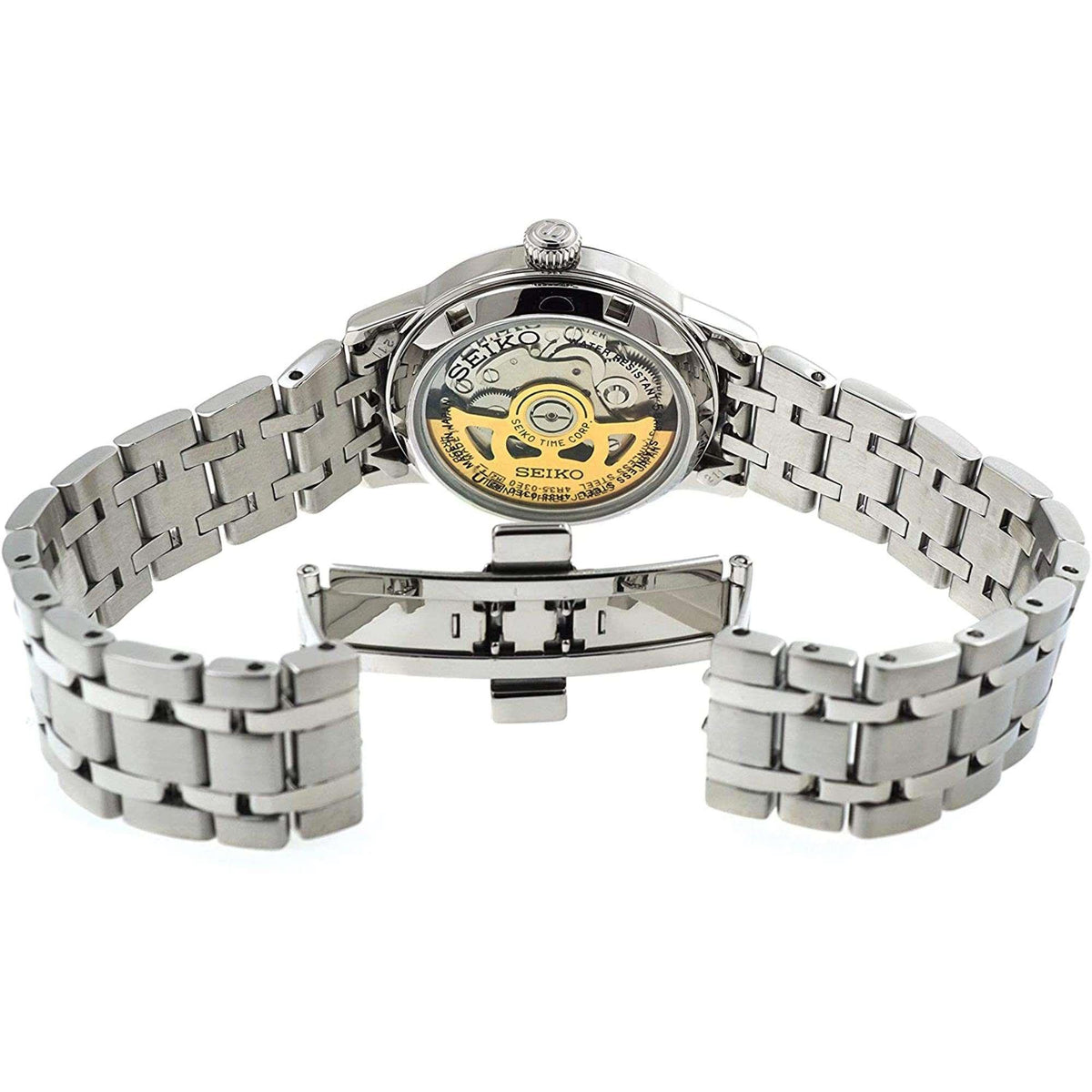 Stainless-steel automatic watch back with visible mechanical movement and bracelet