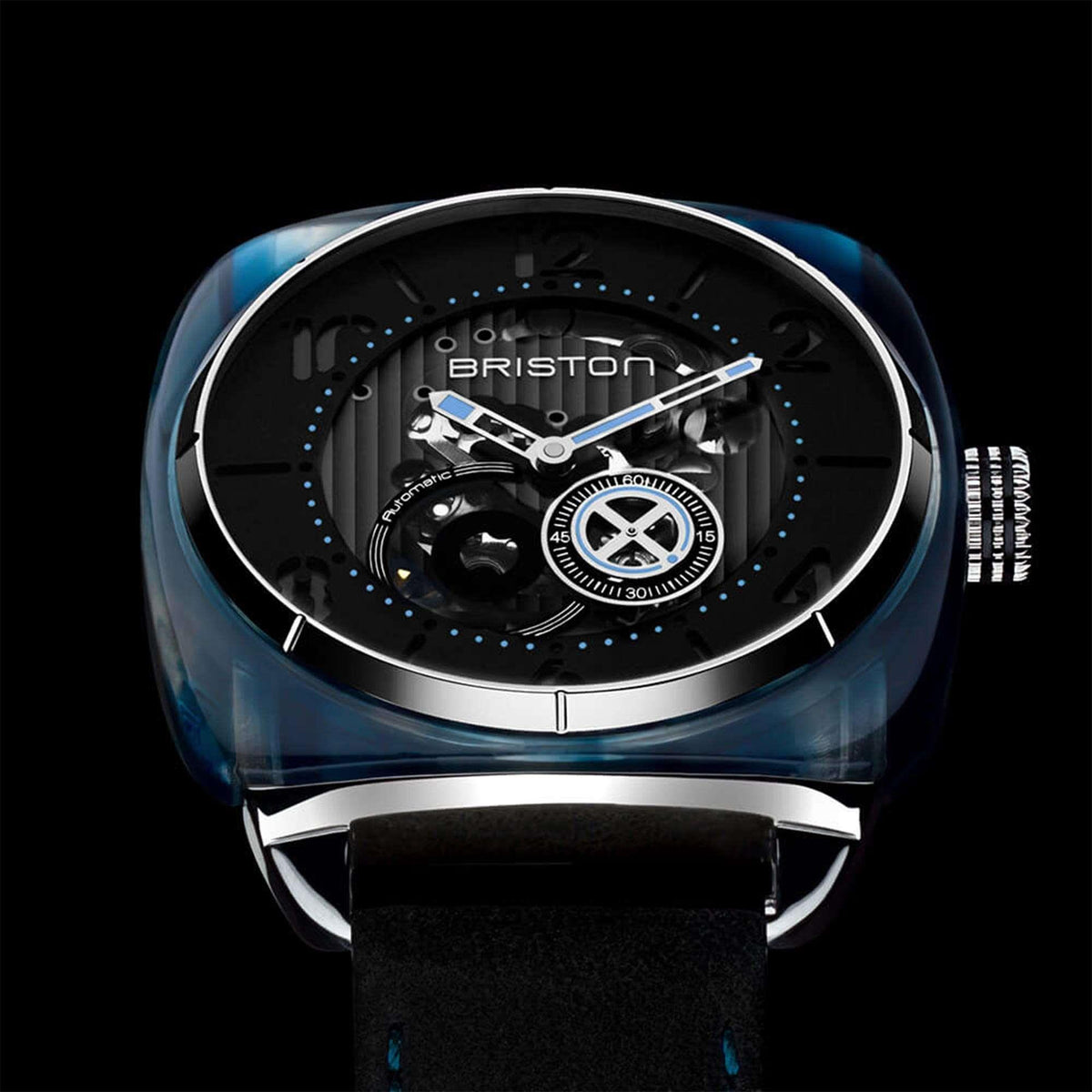 Men’s skeleton watch with black dial, blue-toned bezel, silver hands, and leather strap