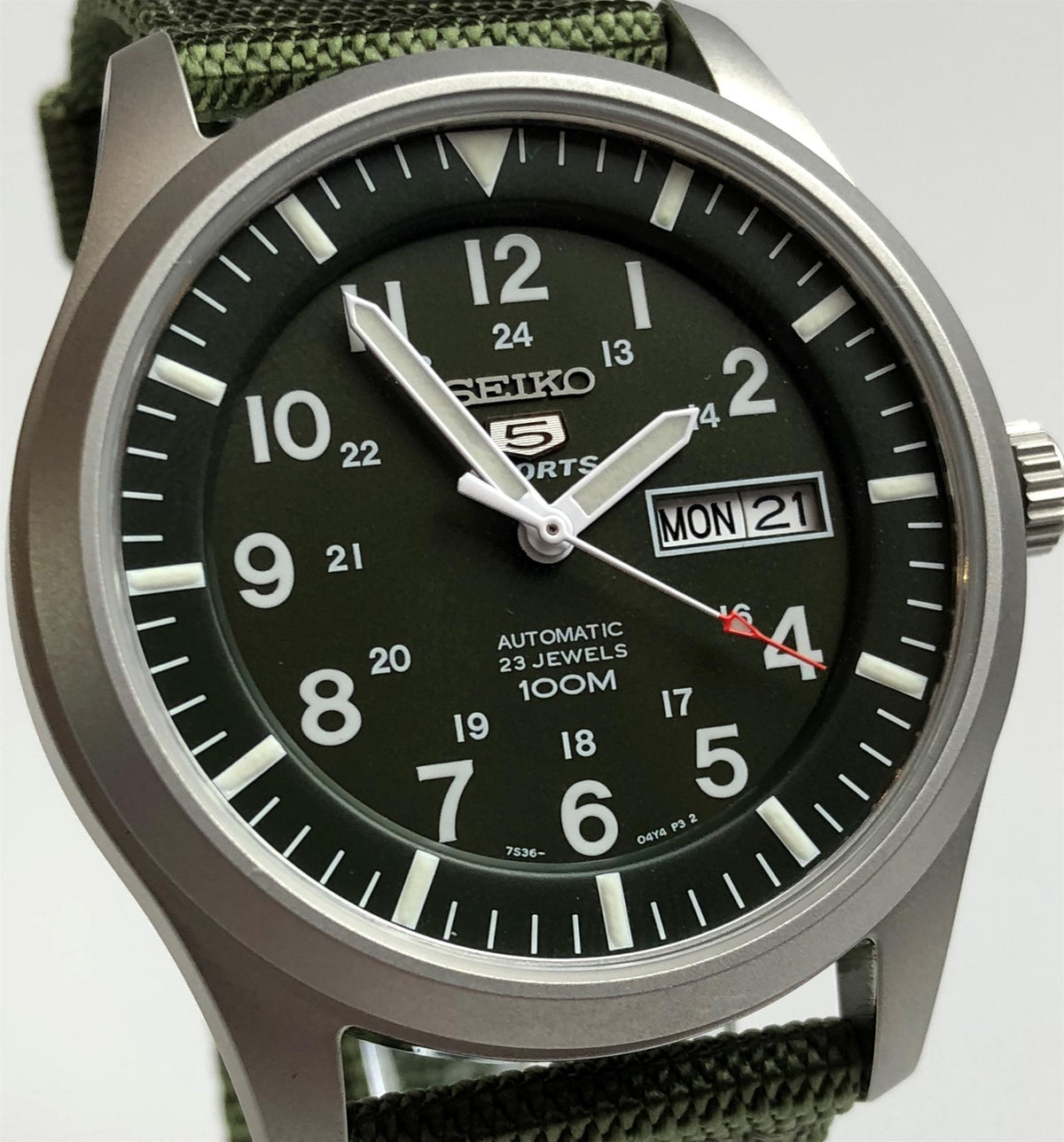 Men's automatic dive watch with dark green dial and MON day-date window