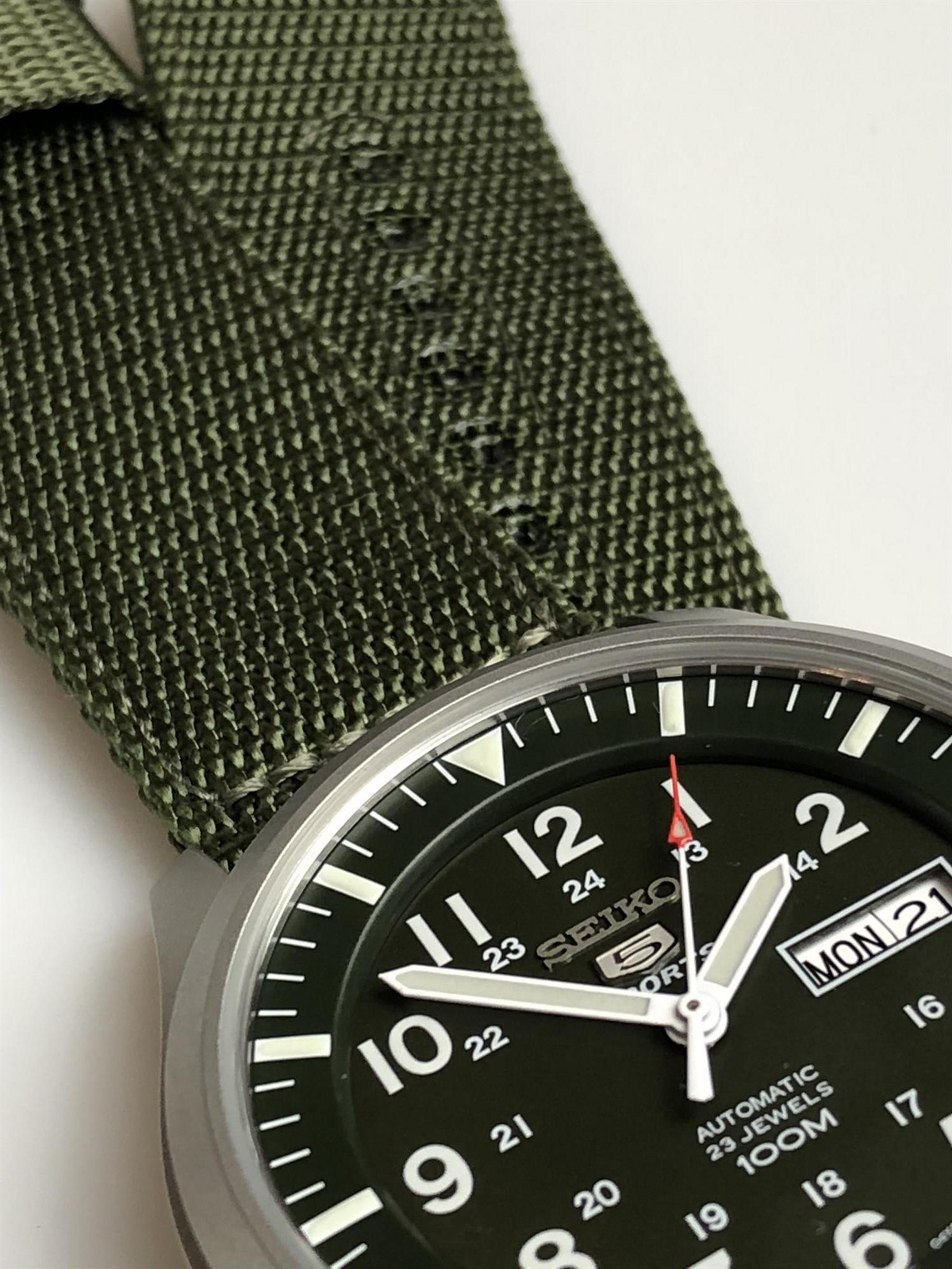 Seiko 5 Sports men's automatic watch, black dial, green NATO strap, day-date window