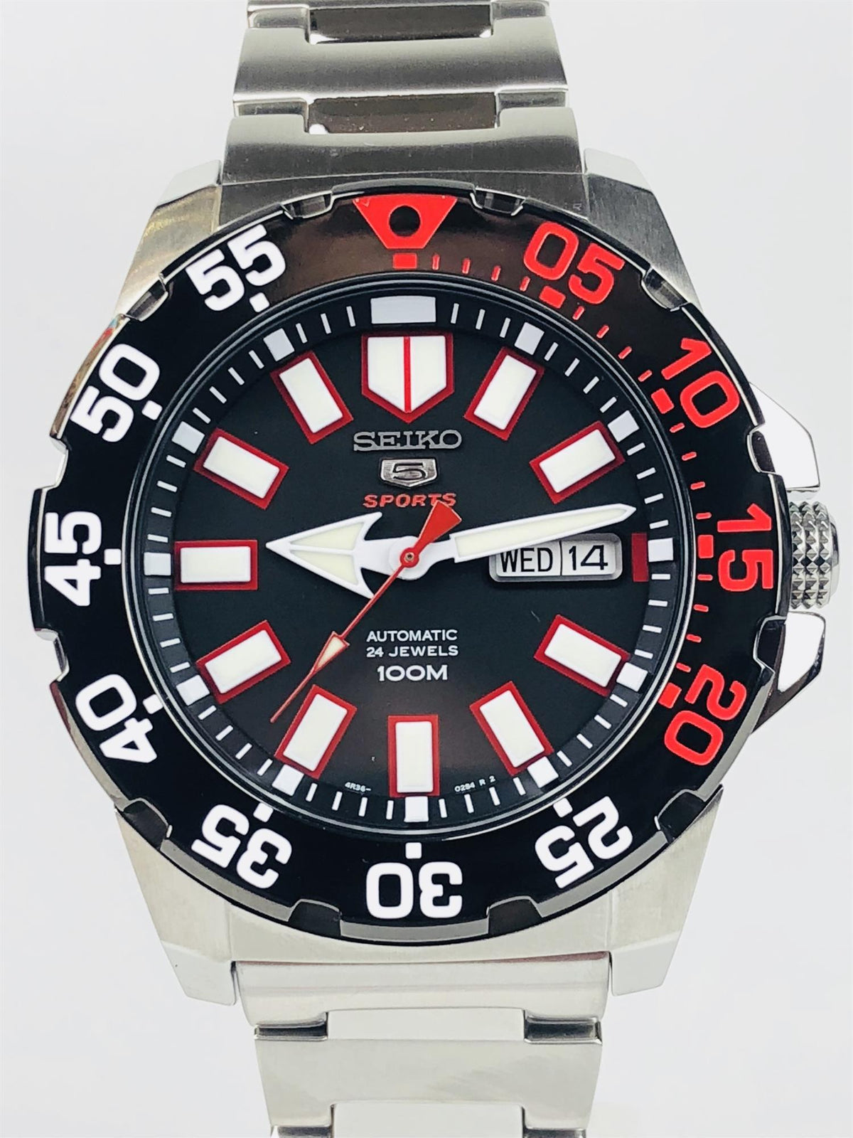 Seiko Sports men’s automatic watch, black dial with date window and red bezel