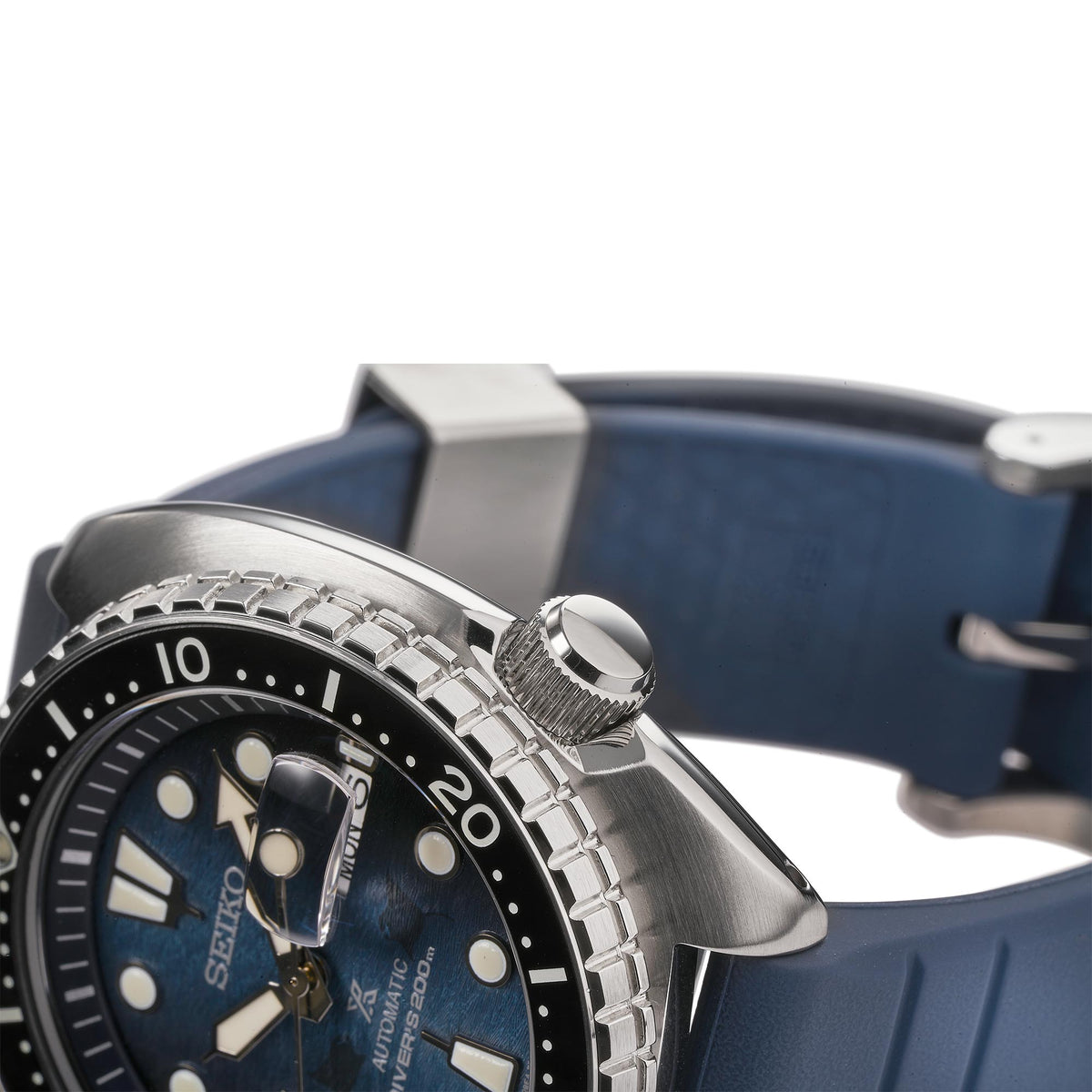 Seiko automatic diving watch side view with steel bezel and blue silicone strap