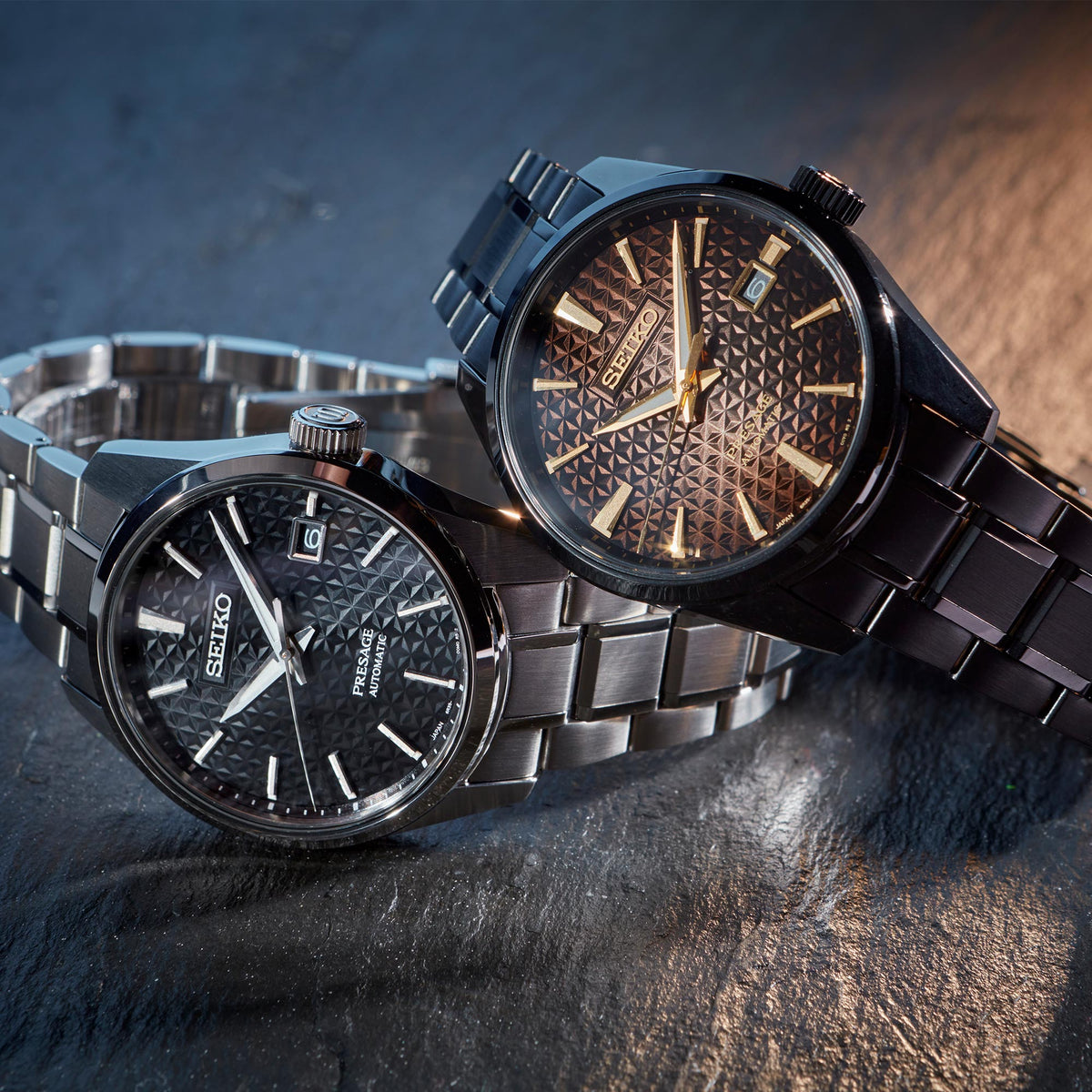 Silver stainless steel men's automatic watch with black dial, baton markers, metal bracelet