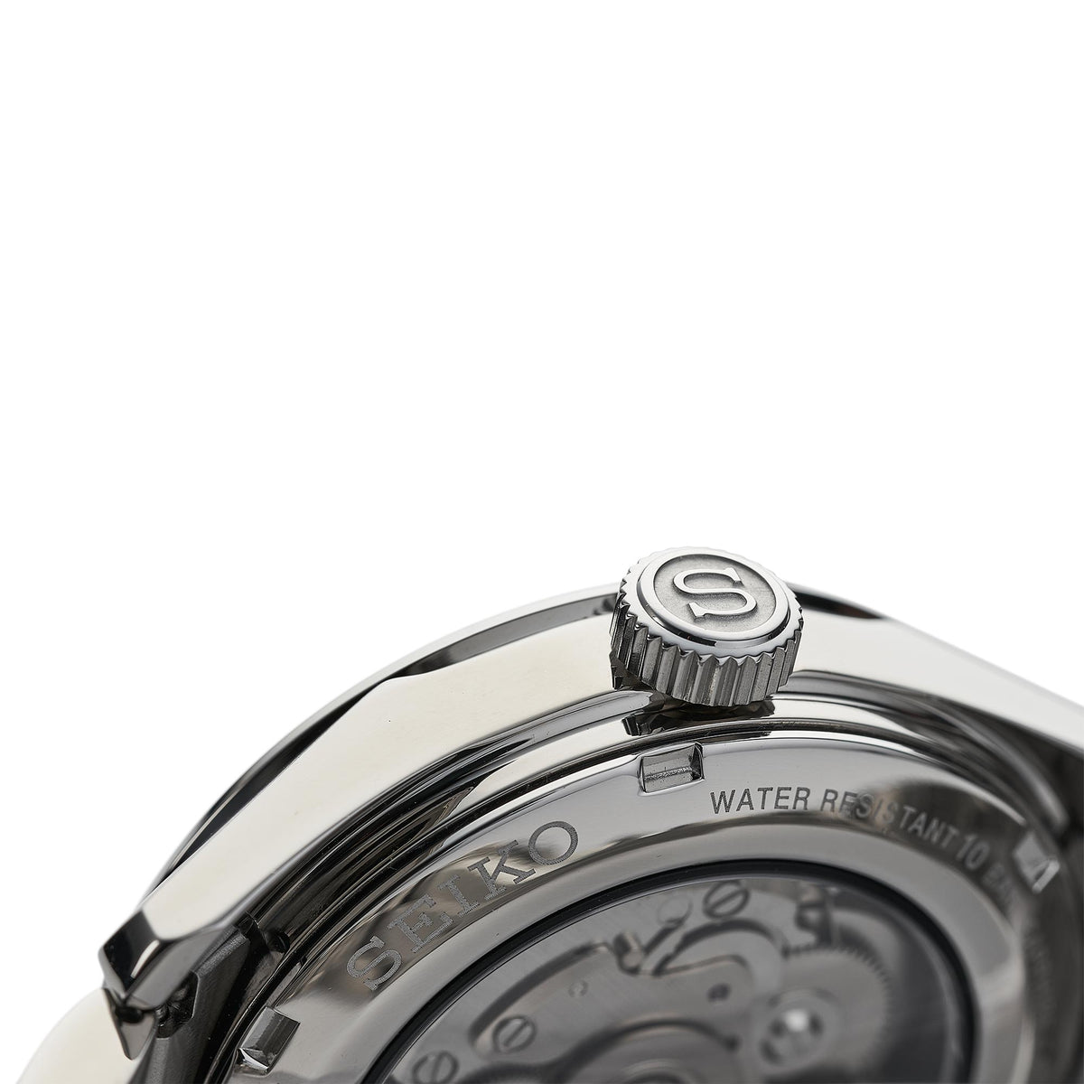 Stainless steel watch crown and case close-up with water resistance text on the bezel