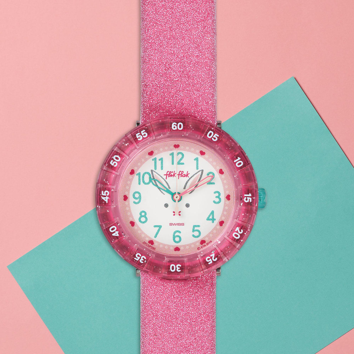 Girls pink glitter silicone watch with white dial, colorful numerals and turquoise hands
