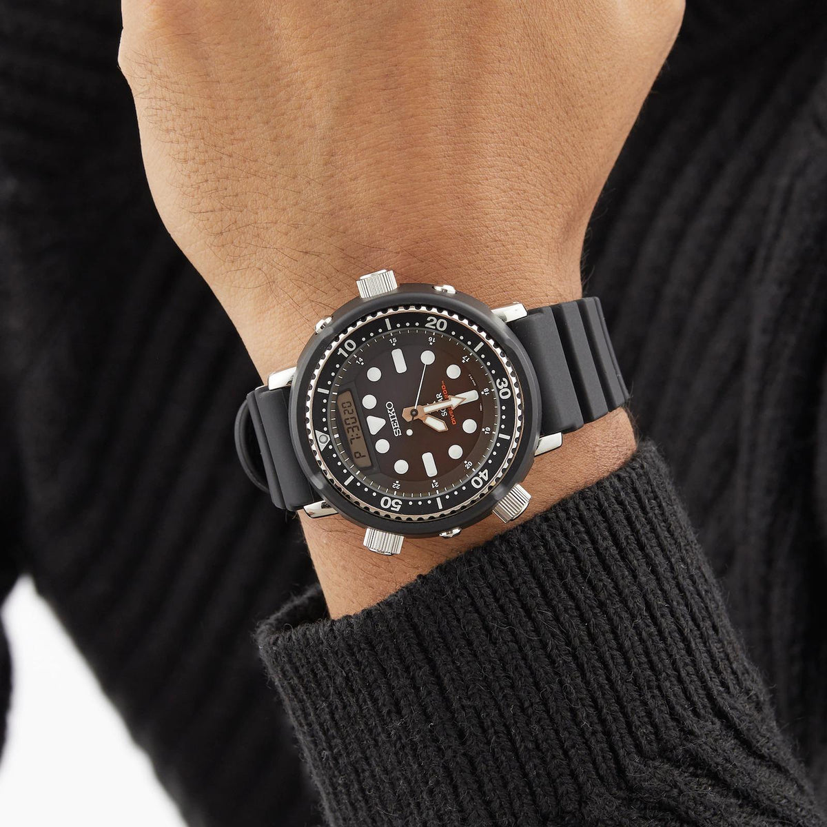 Seiko Prospex dive watch on wrist with black dial and black silicone strap