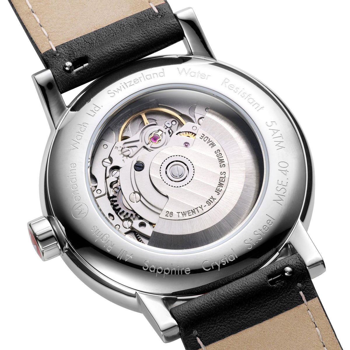 Close-up of watch movement through sapphire crystal case back and black leather strap