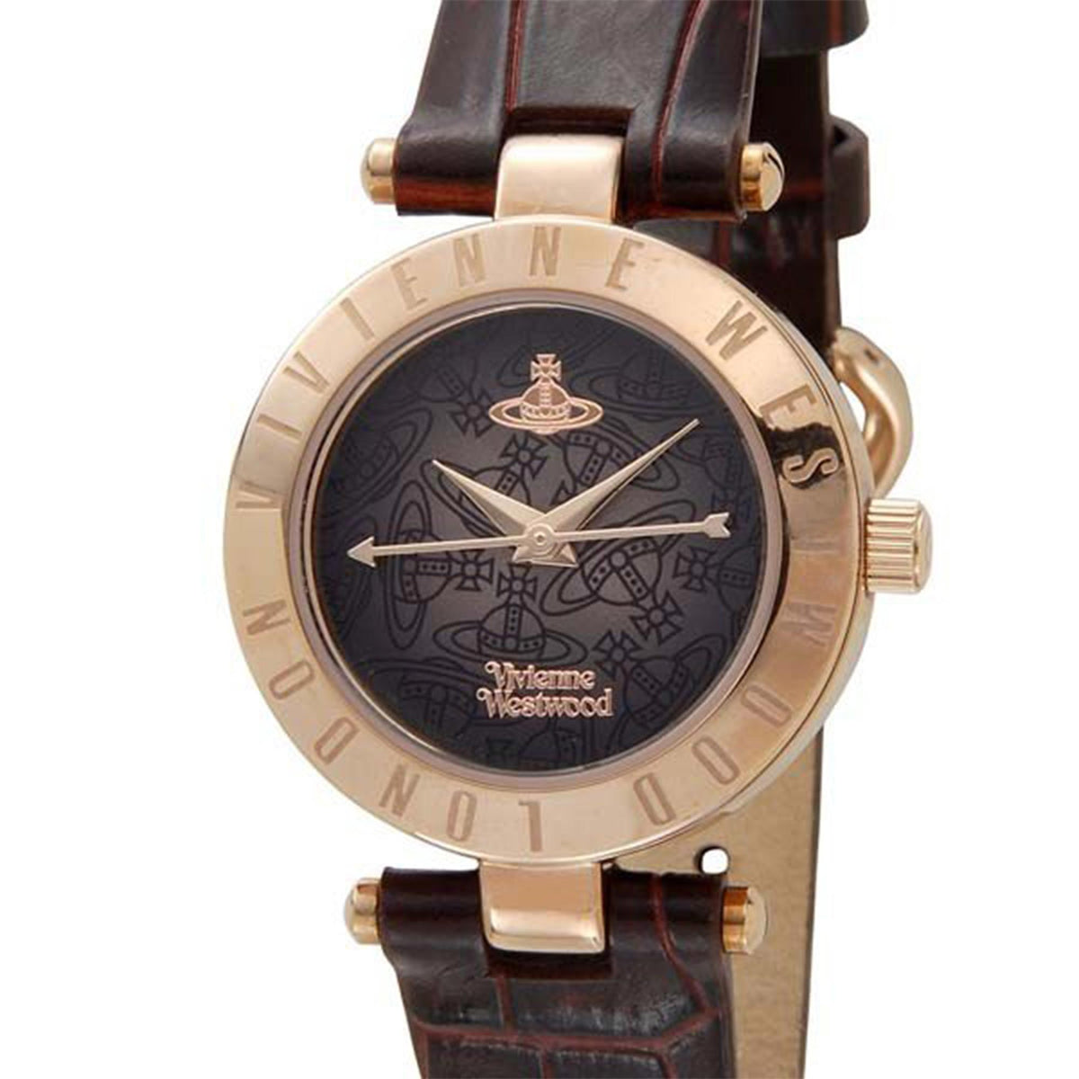 Women's quartz watch close-up, dark patterned dial with gold hands, brown leather strap