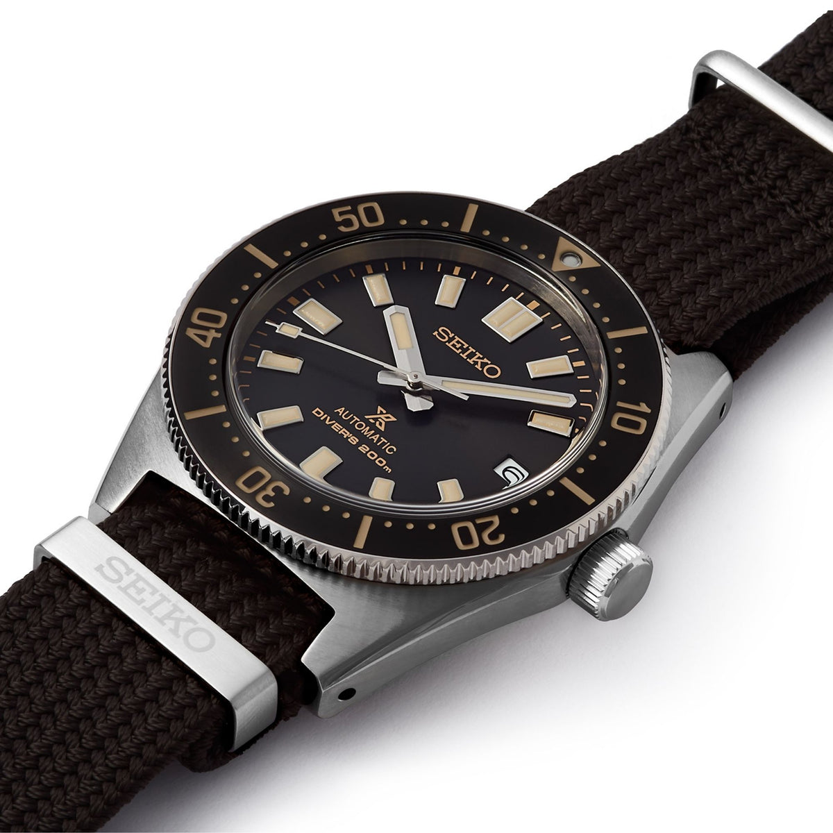 Men's Seiko diver watch angled view, black dial, gold numbers, and brown nylon strap
