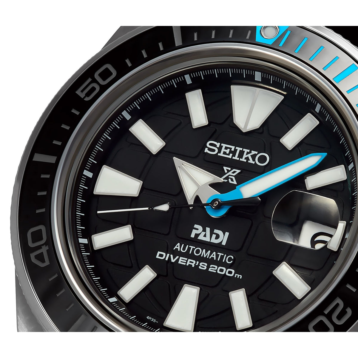 Seiko diver watch face with white hour markers, blue seconds hand, and PADI branding