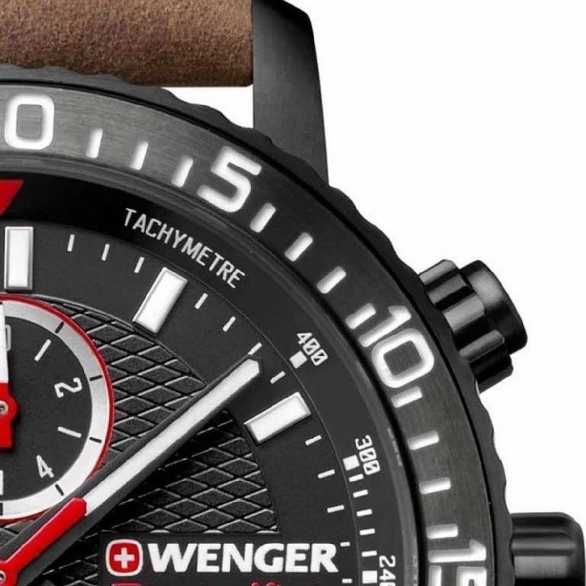 Close-up of tachymetre bezel with white markers and red details on black dial