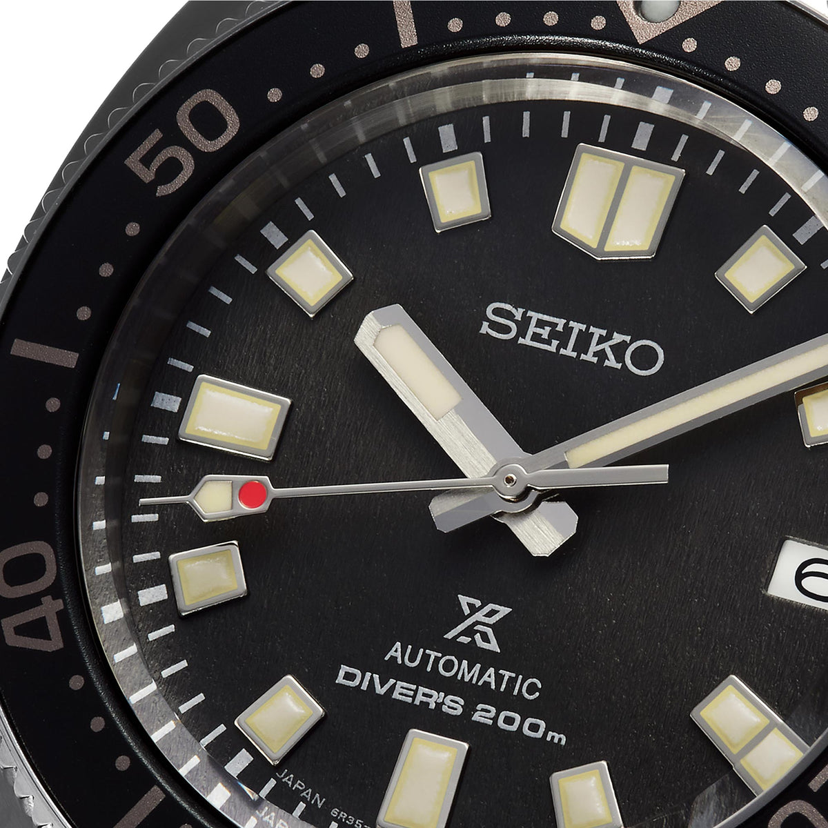 Seiko watch face with black dial and white markings