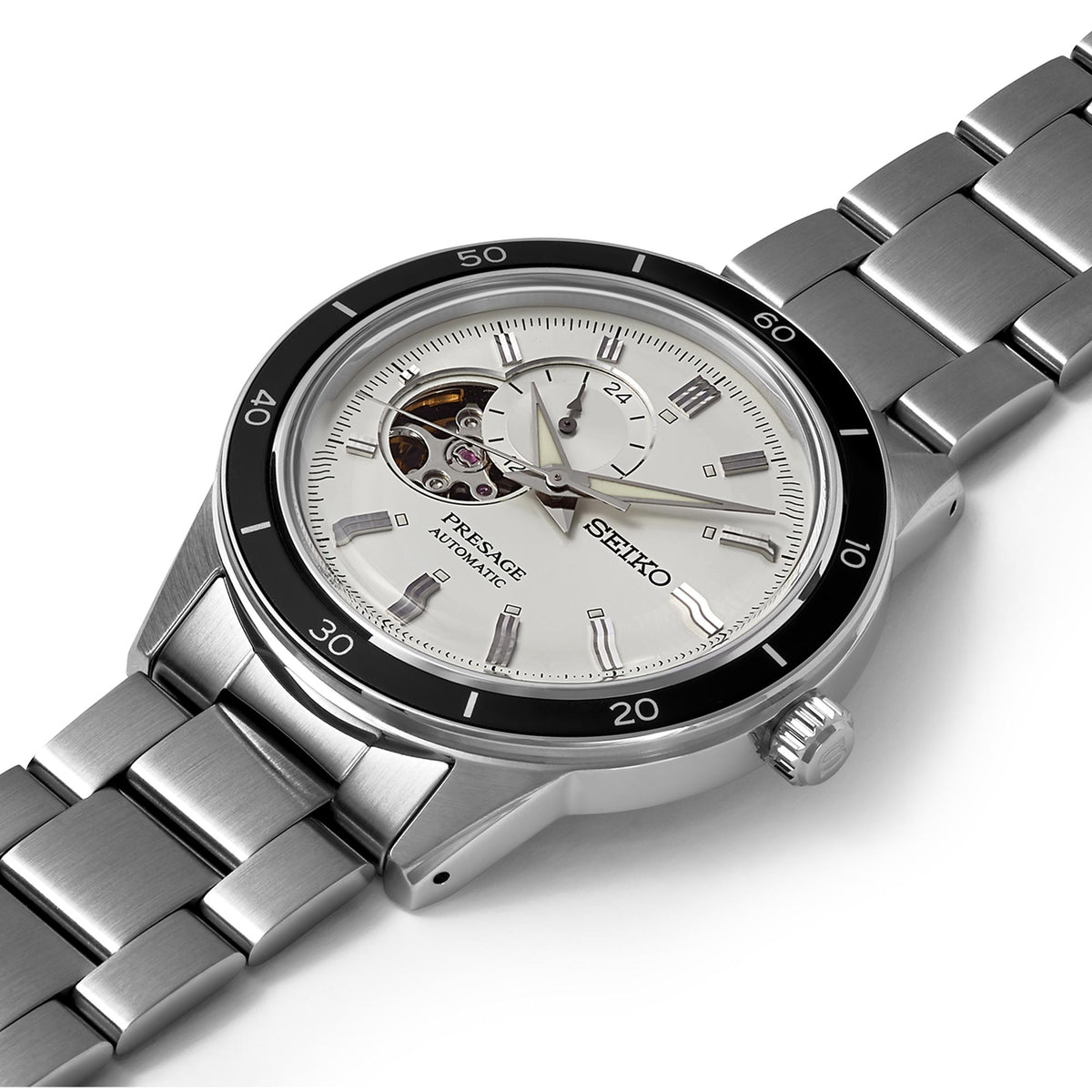 Men's stainless steel automatic watch close angled view with silver dial and black bezel