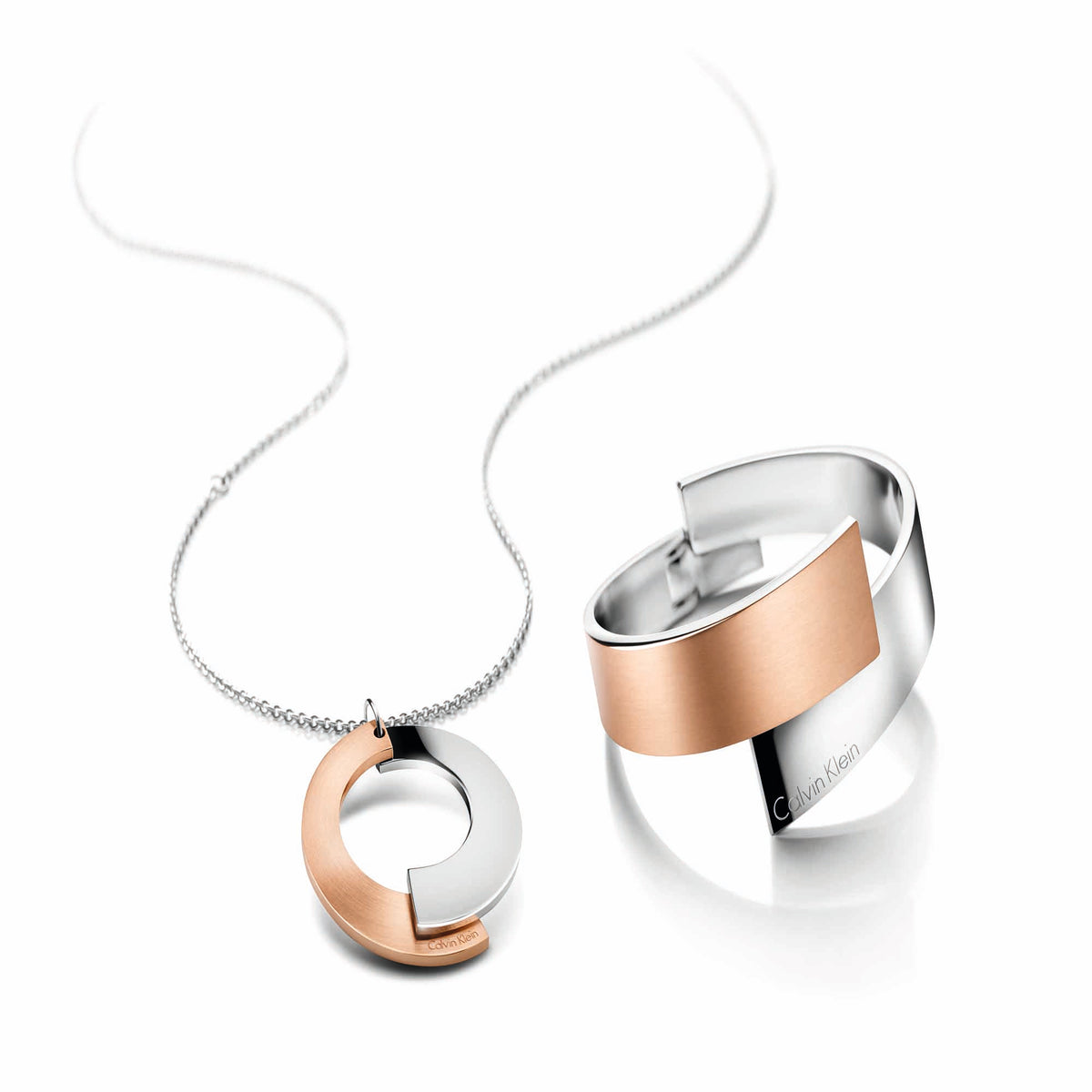 Matching pendant necklace set: round cutout charm in rose gold and stainless steel