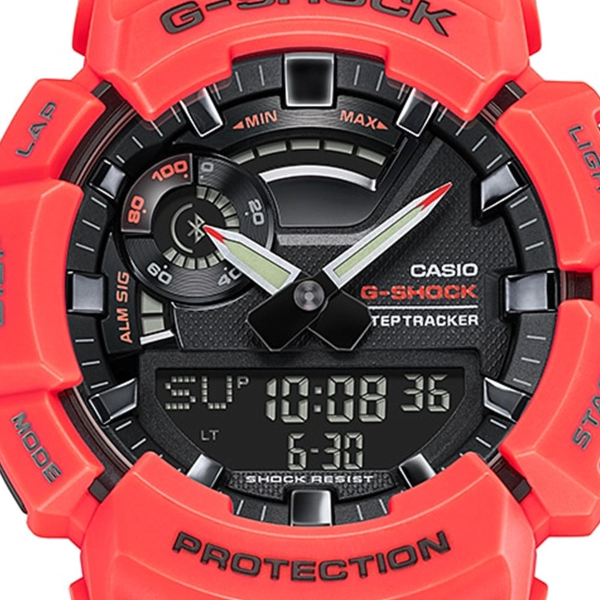 Casio G-Shock watch close-up: black dial, red resin case, digital time display.