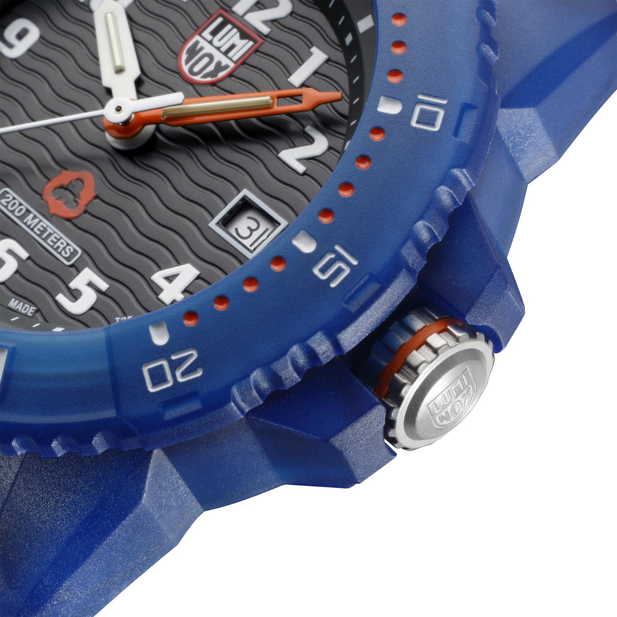 Luminox watch side view showing blue case details, crown, and grooved bezel markings