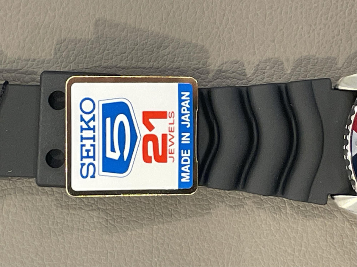 Seiko SKX009J1 watch band with a logo indicating 21 jewels and 'Made in Japan'.
