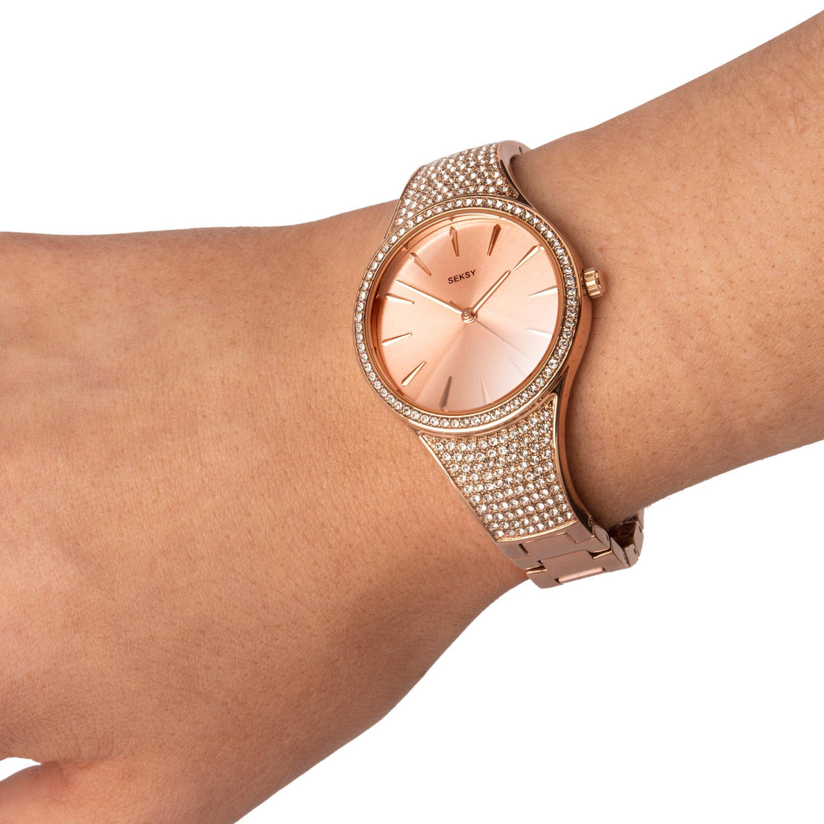 Rose gold ladies quartz watch on wrist, peach dial, crystal link bracelet