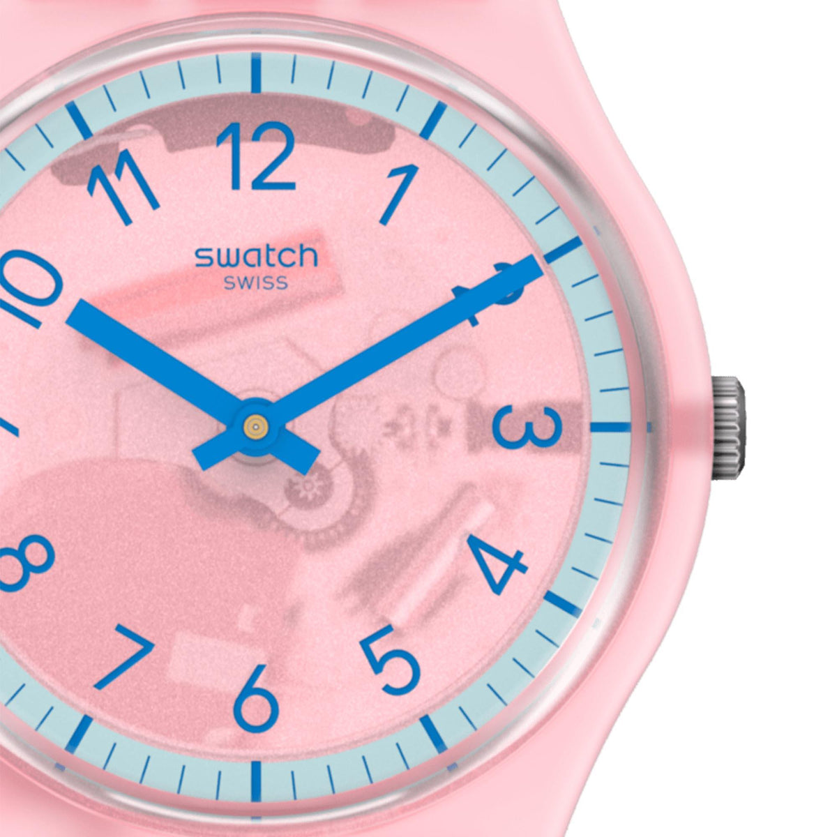 Close-up pink dial quartz watch with blue hands, silver bezel, and pink silicone strap