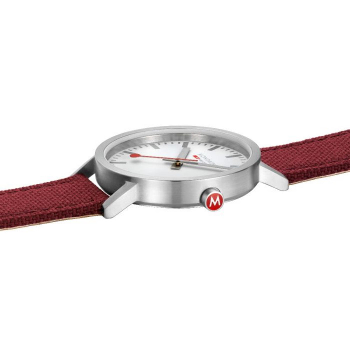 Mondaine quartz watch face close-up with white dial, red hands, silver bezel