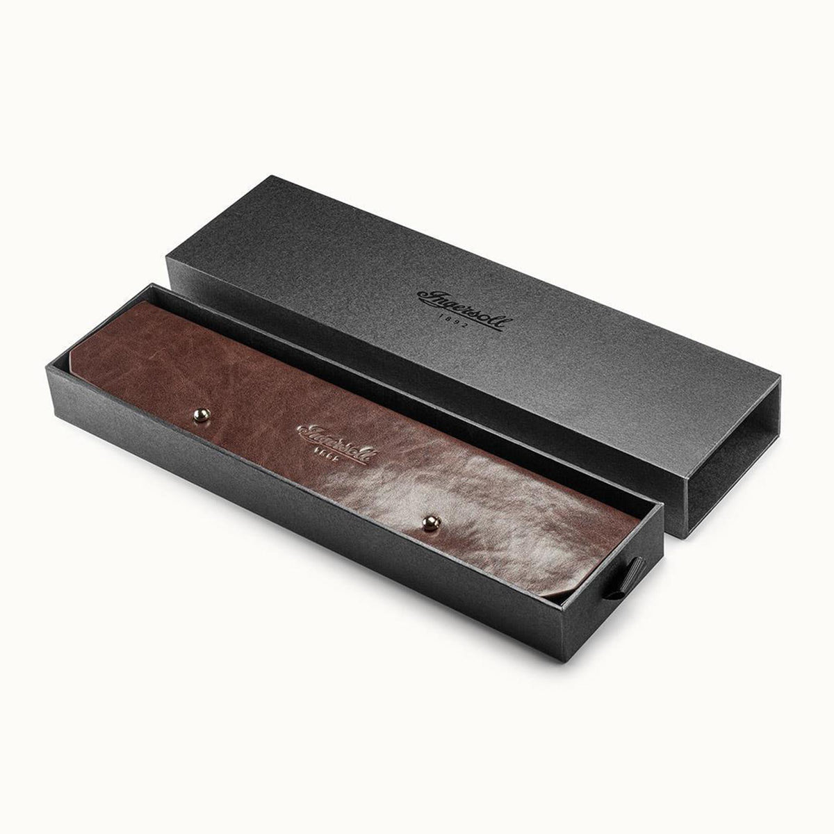 Watch in black gift box with visible brown leather strap inside