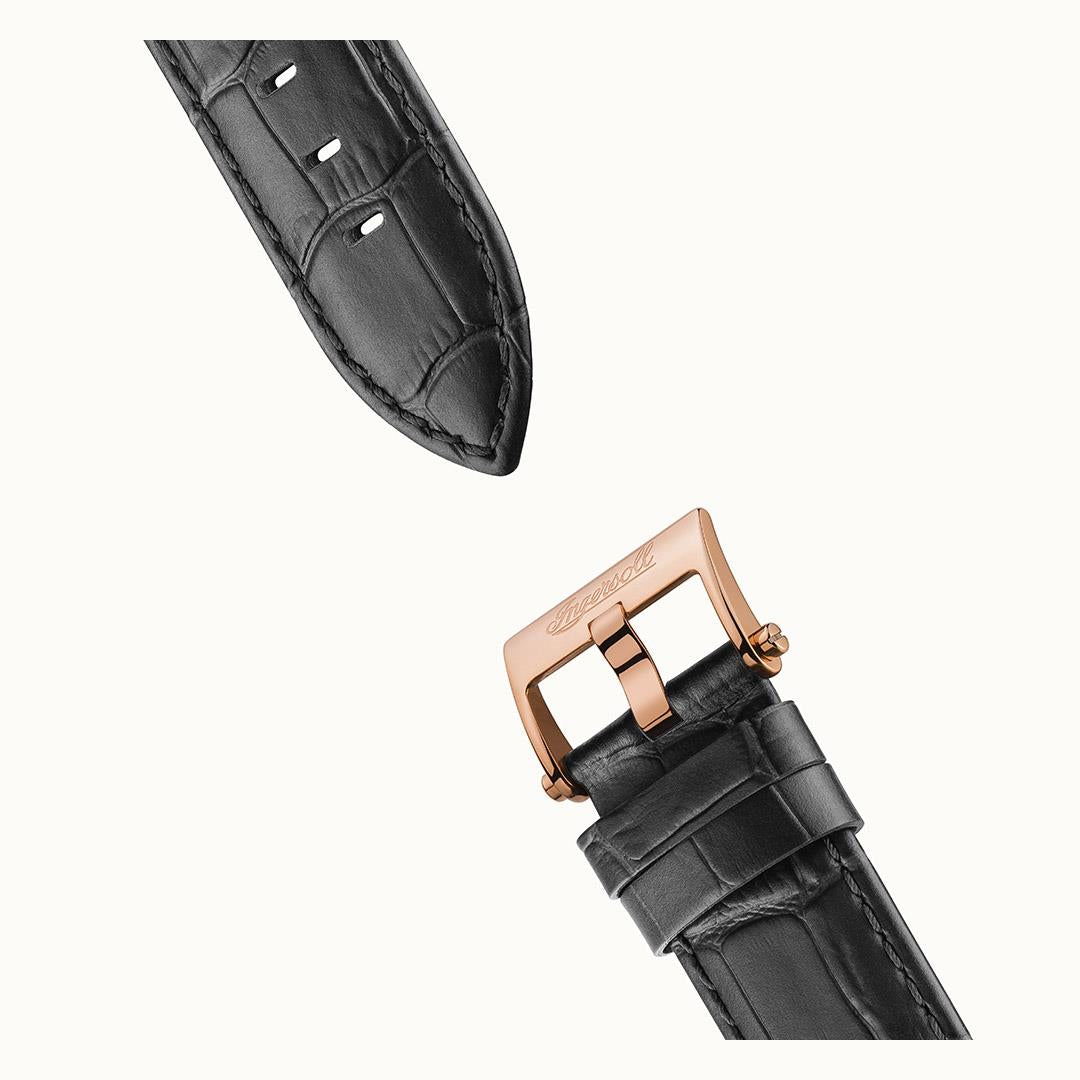 Black leather watch strap end with stitches and rose-gold tone buckle and clasp.