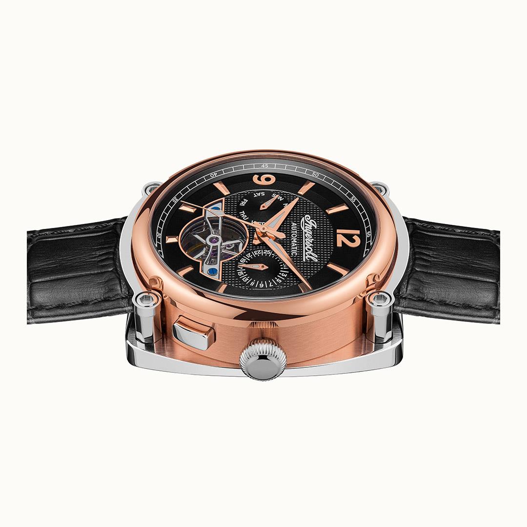 Men's automatic wristwatch front view showing black dial skeleton details and rose-gold case.