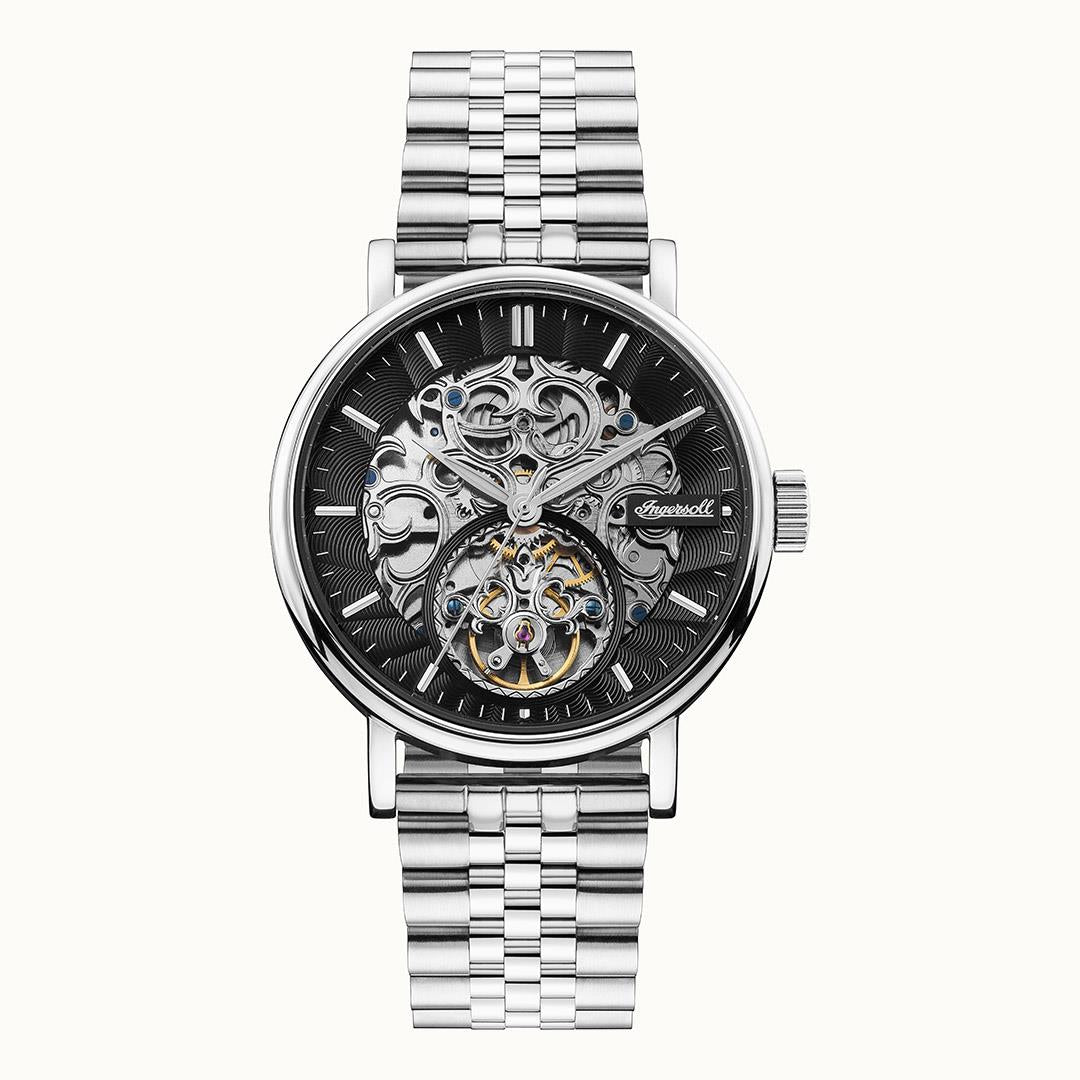 Round automatic men’s watch with black skeleton dial, chrome bezel, and stainless steel bracelet