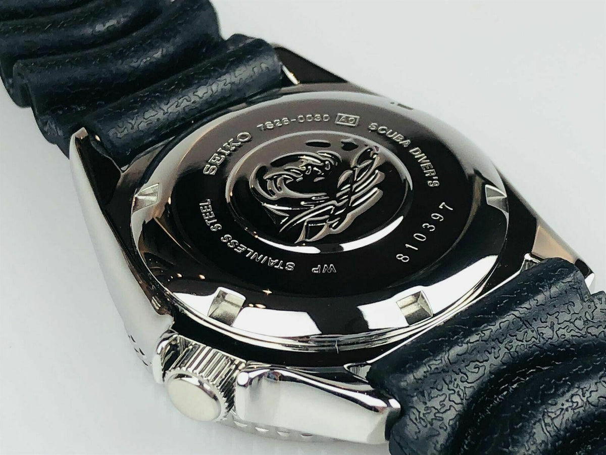 Men's diver's watch case back with engraved seal and sea-creature design