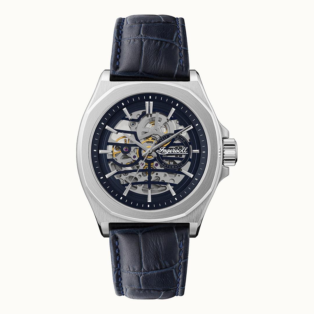Men's automatic watch front view with navy dial, silver bezel, and navy leather strap.