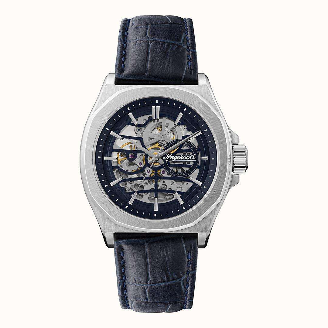 Men's automatic watch front view with navy dial, silver case, and navy leather strap.
